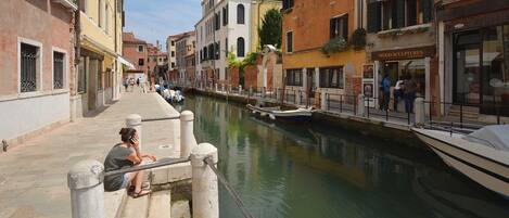 A canal in a historic European town with buildings on either side.