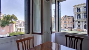 A room with a view of Venice's historic buildings and canals. - GRITTI Grand Canal (Venice)