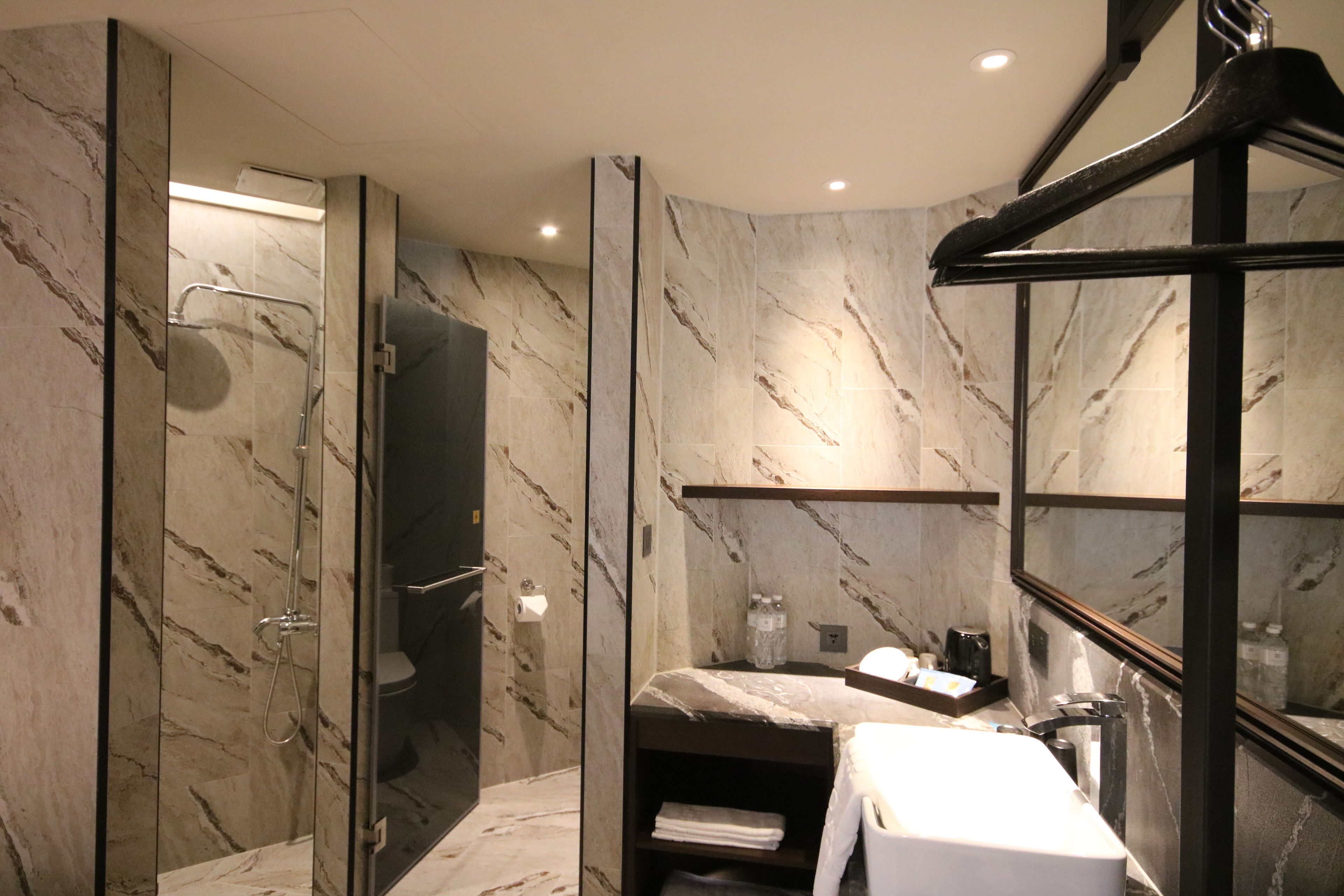 city family room | bathroom | shower, hair dryer, slippers, towels