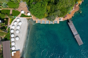 Private beach, black sand, free beach cabanas, sun loungers