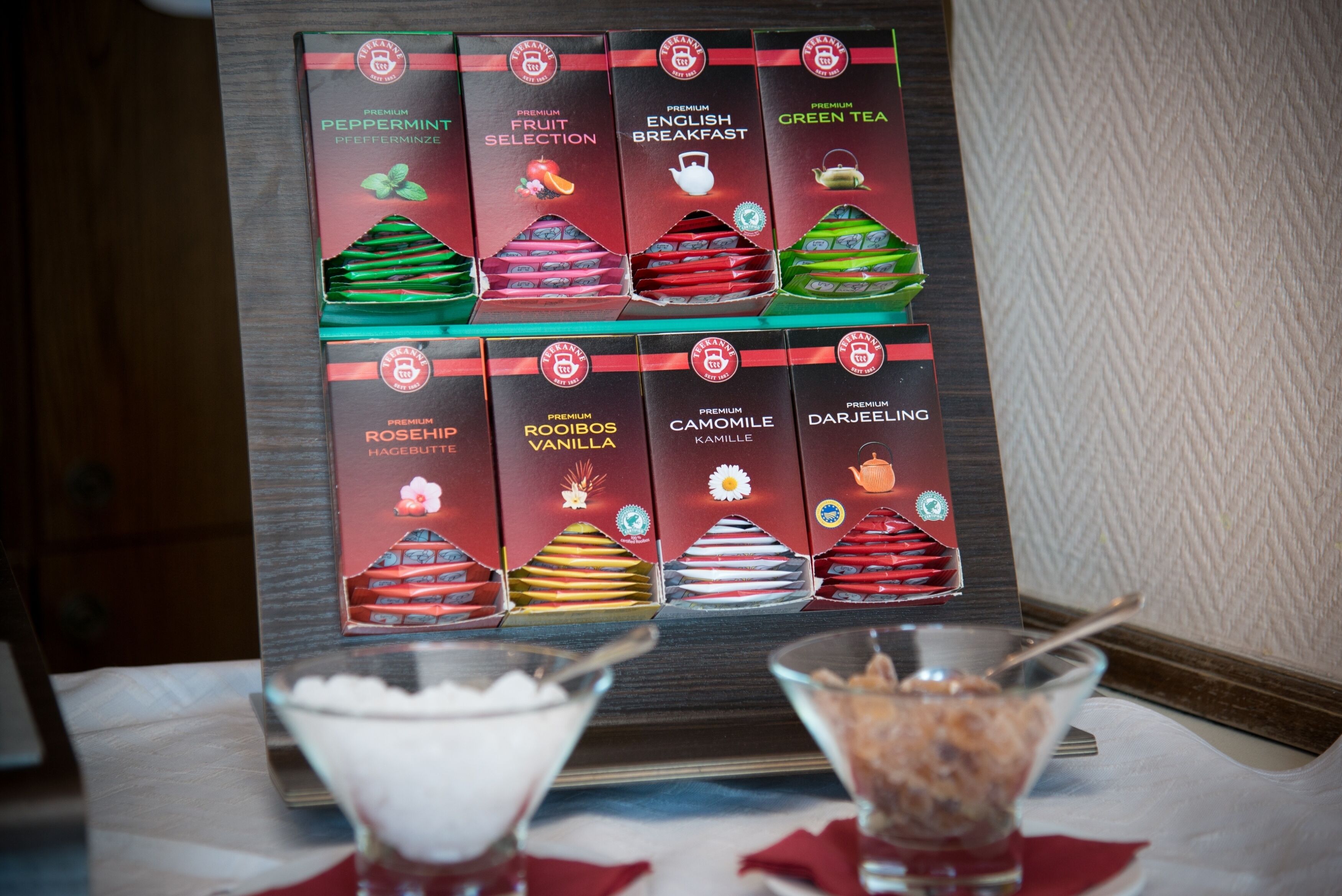A display of tea boxes with labels such as "Peppermint," "Fruit Selection," and "English Breakfast."