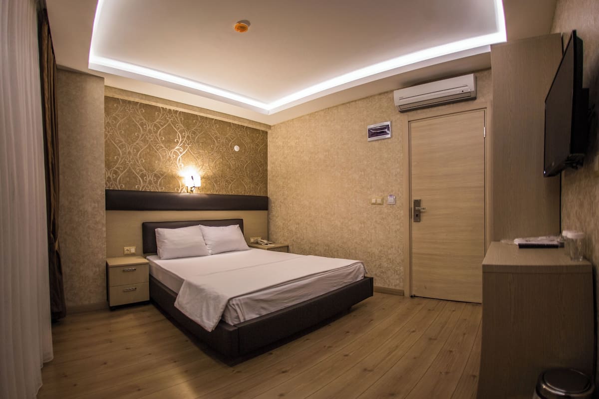 Standard Double or Twin Room | Minibar, in-room safe, desk, laptop workspace
