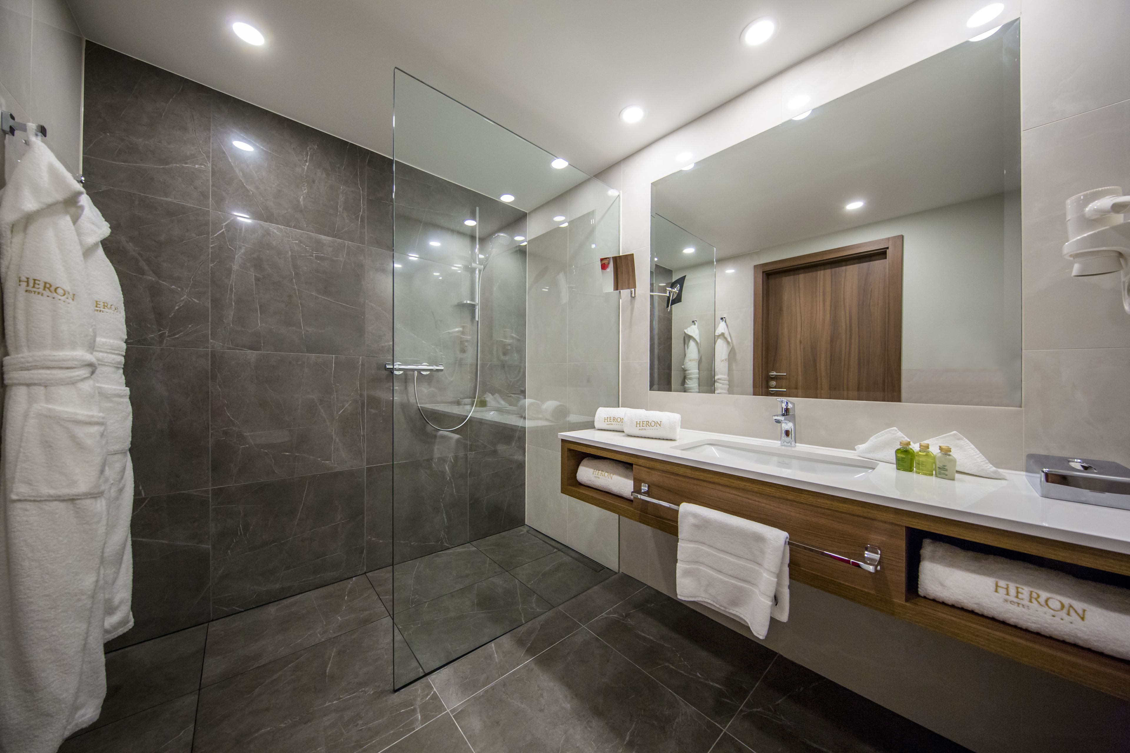 comfort double room, lake view (plus; free spa access) | bathroom | designer toiletries, hair dryer, bathrobes, slippers