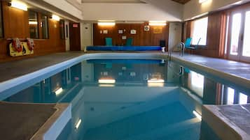 Indoor pool, open 8 AM to 8 PM, pool umbrellas, sun loungers