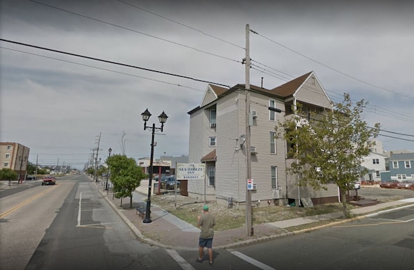 A two-story building with a sign for 'Seaview Inn' and a visible parking lot.