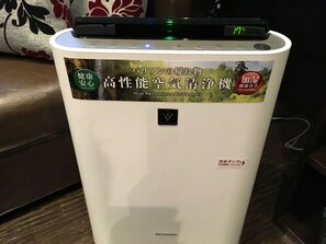 A white appliance with a digital display and stickers indicating it is a high-performance air purifier. - Hotel Balian Resort Namba Shinsaibashi - Near Dotonbori (Osaka)