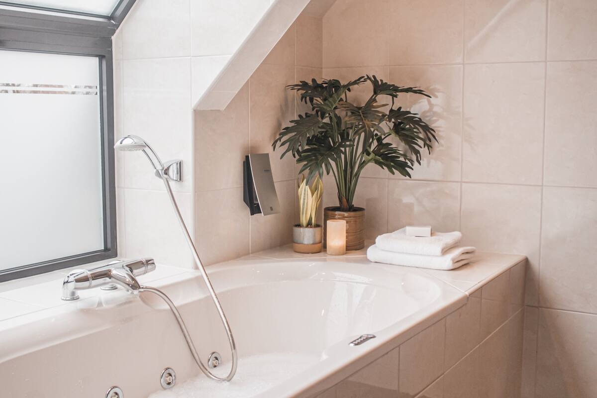 suite, jetted tub | 1 bedroom, in-room safe, desk, free wifi