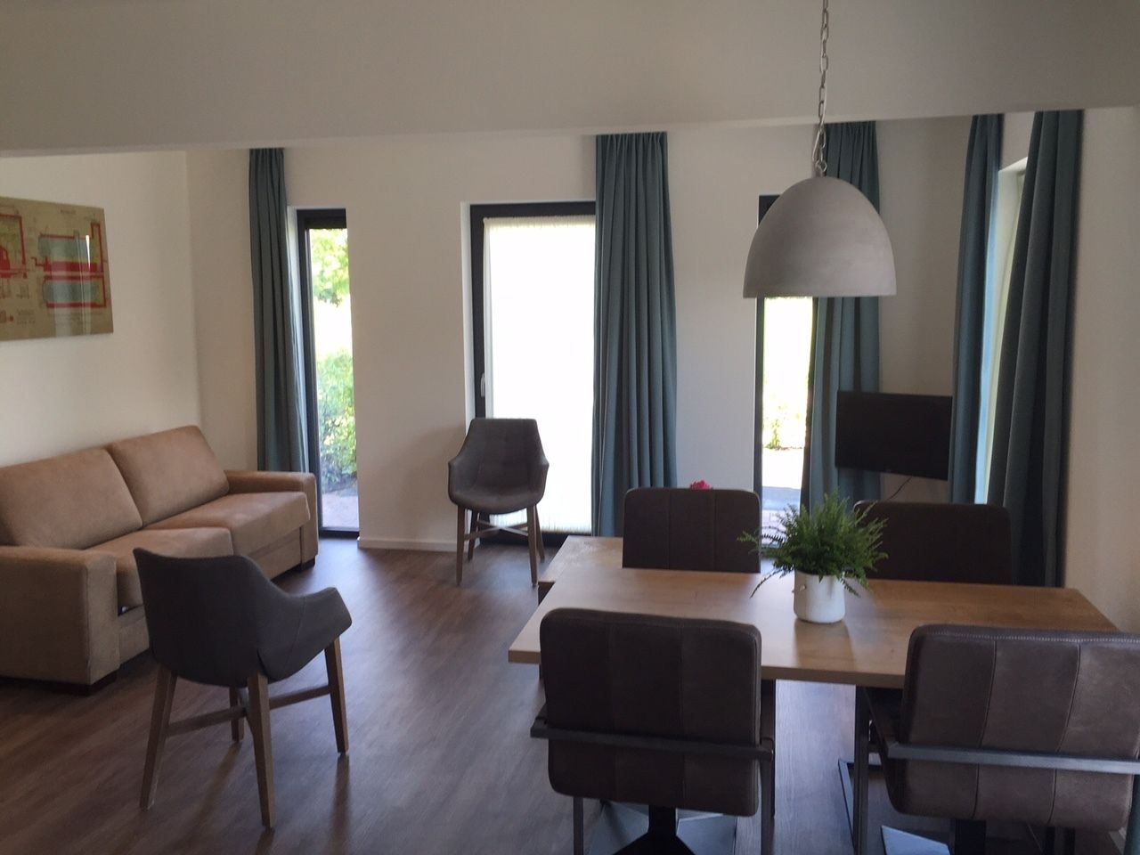 luxury apartment, annex building | living room | flat-screen tv, table football