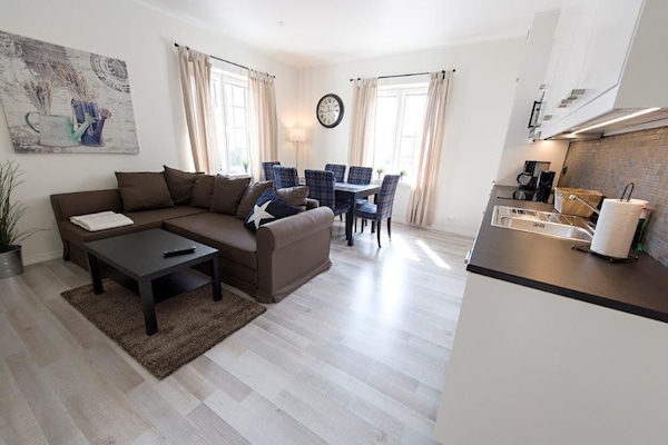 Apartment, 2 Bedrooms | Living area | 50-inch flat-screen TV with cable channels, TV