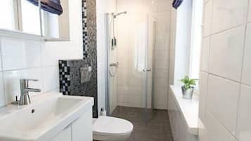 Apartment, 2 Bedrooms | Bathroom | Shower, free toiletries, hair dryer, towels