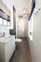 Apartment, 2 Bedrooms | Bathroom | Shower, free toiletries, hair dryer, towels