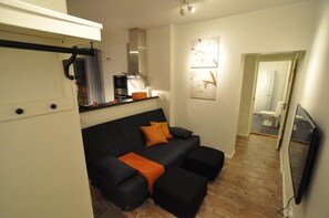 Apartment, 1 Bedroom | Living area | 50-inch flat-screen TV with cable channels, TV - Townhouse Apartments (Mariehamn)