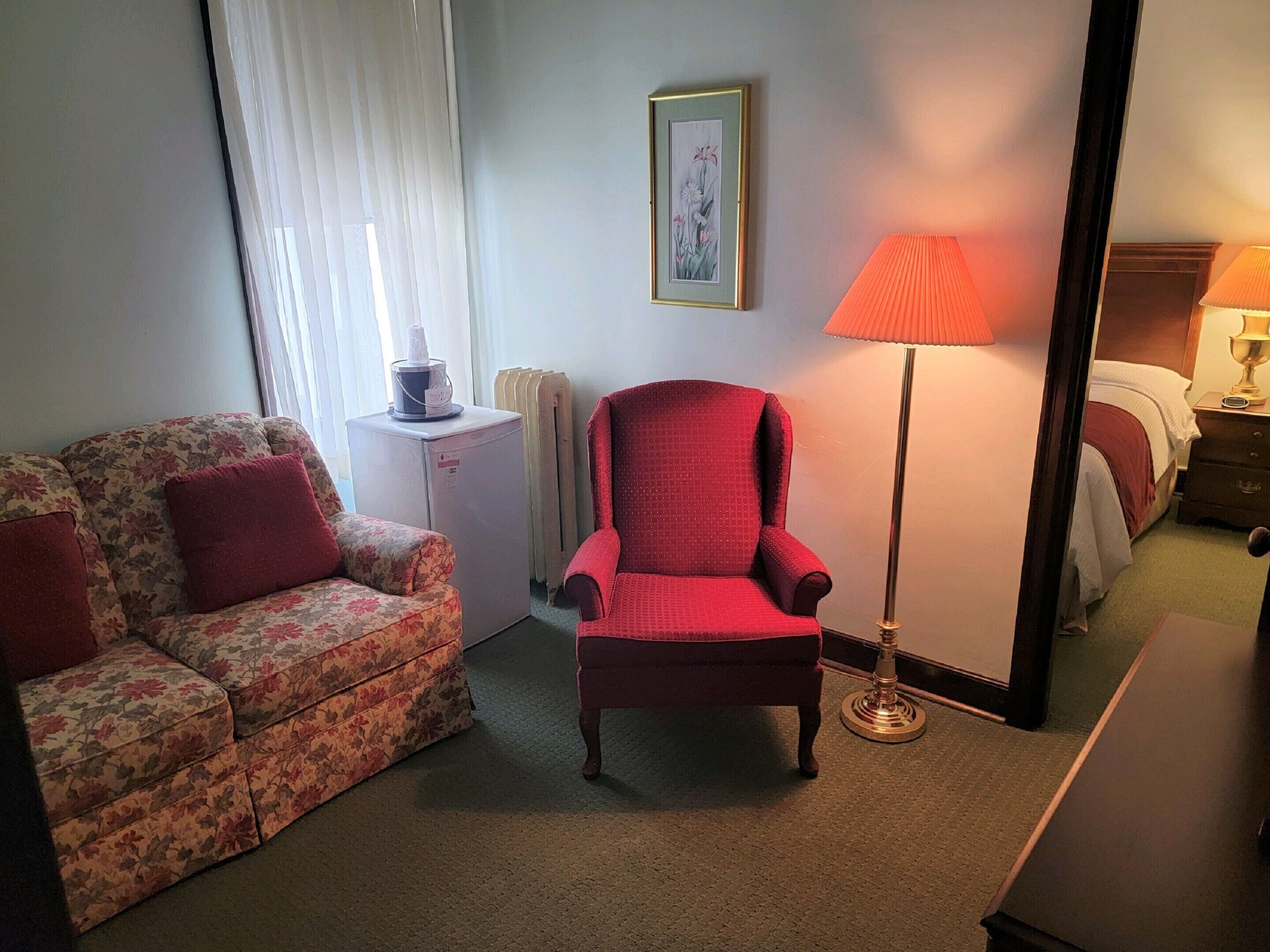 one queen bed and one double bed with sitting area | living area | 1-inch flat-screen tv with cable channels, tv