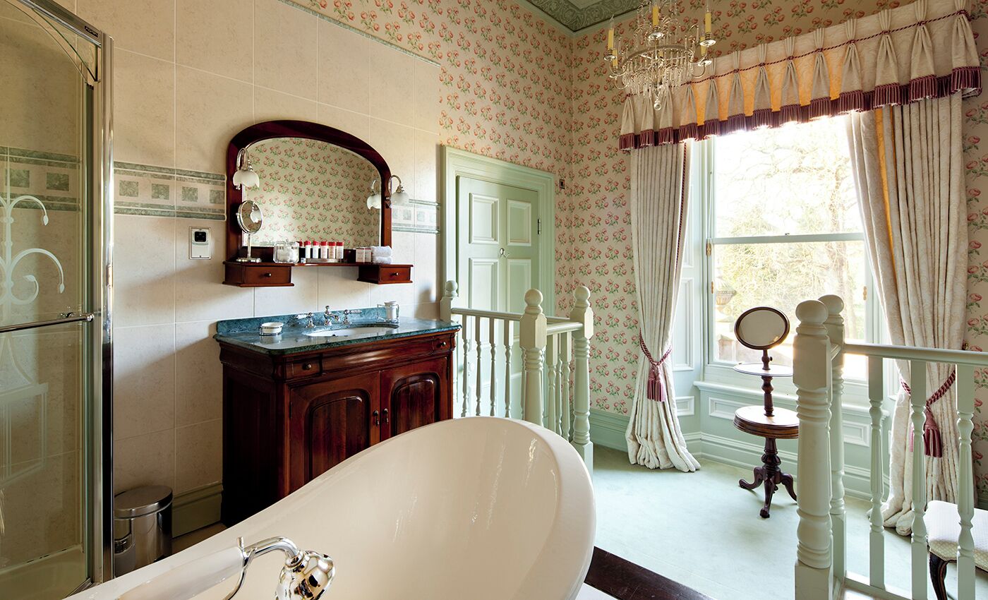 four poster suite | bathroom | combined shower/bathtub, designer toiletries, hair dryer, towels