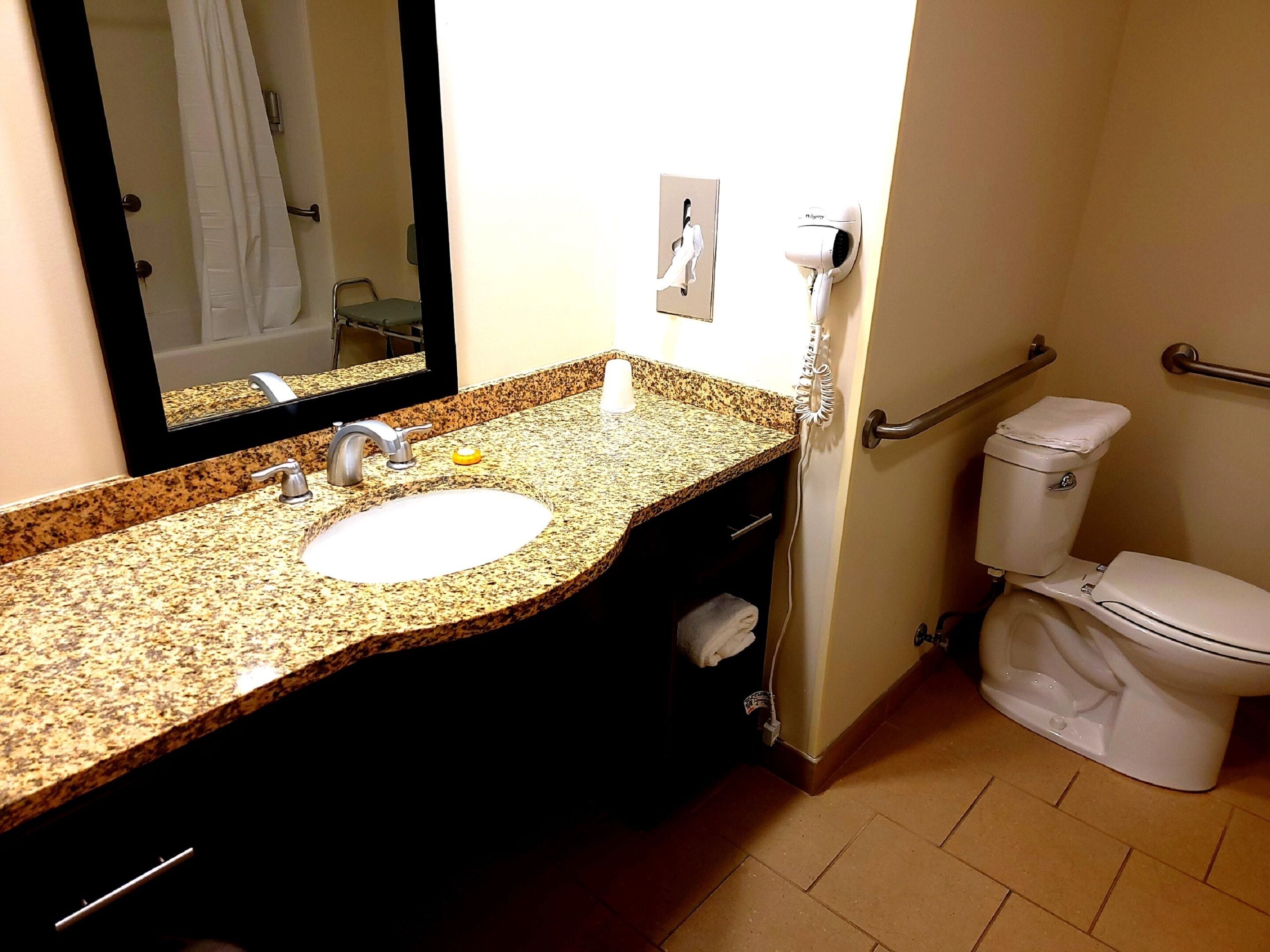 suite, 2 queen beds mobility and hearing accessible | bathroom | combined shower/bathtub, free toiletries, hair dryer, towels