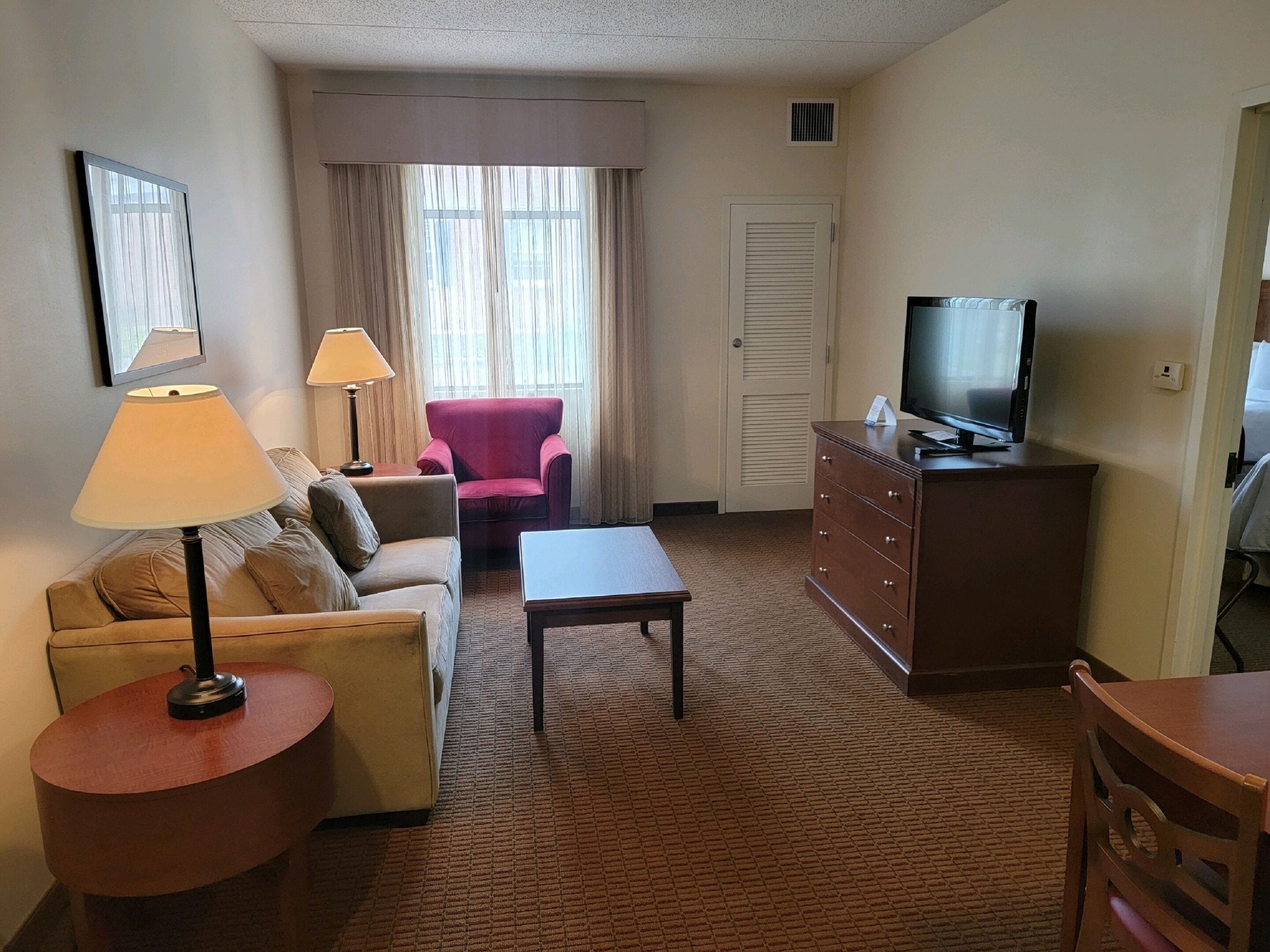 queen suite (2 queen beds) | living area | flat-screen tv