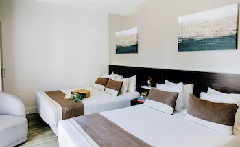 Hotel amenities such as safe, desk and work area at Casa Boutique Hotel