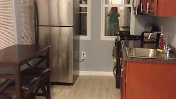 Fridge, microwave, stovetop, coffee/tea maker