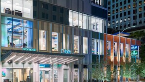 A modern hotel with a glass facade, outdoor seating, and a prominent 'Element' sign. - Element by Marriott Austin Downtown (Austin)