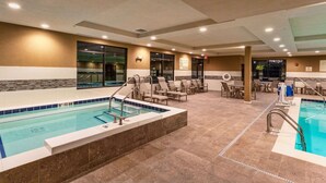 A hotel swimming pool area with multiple pools, lounge chairs, and a seating area. - Hampton Inn & Suites Duluth North/Mall Area (Duluth)