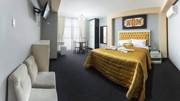 Deluxe Suite, 1 King Bed, City View | Premium bedding, desk, blackout drapes, soundproofing