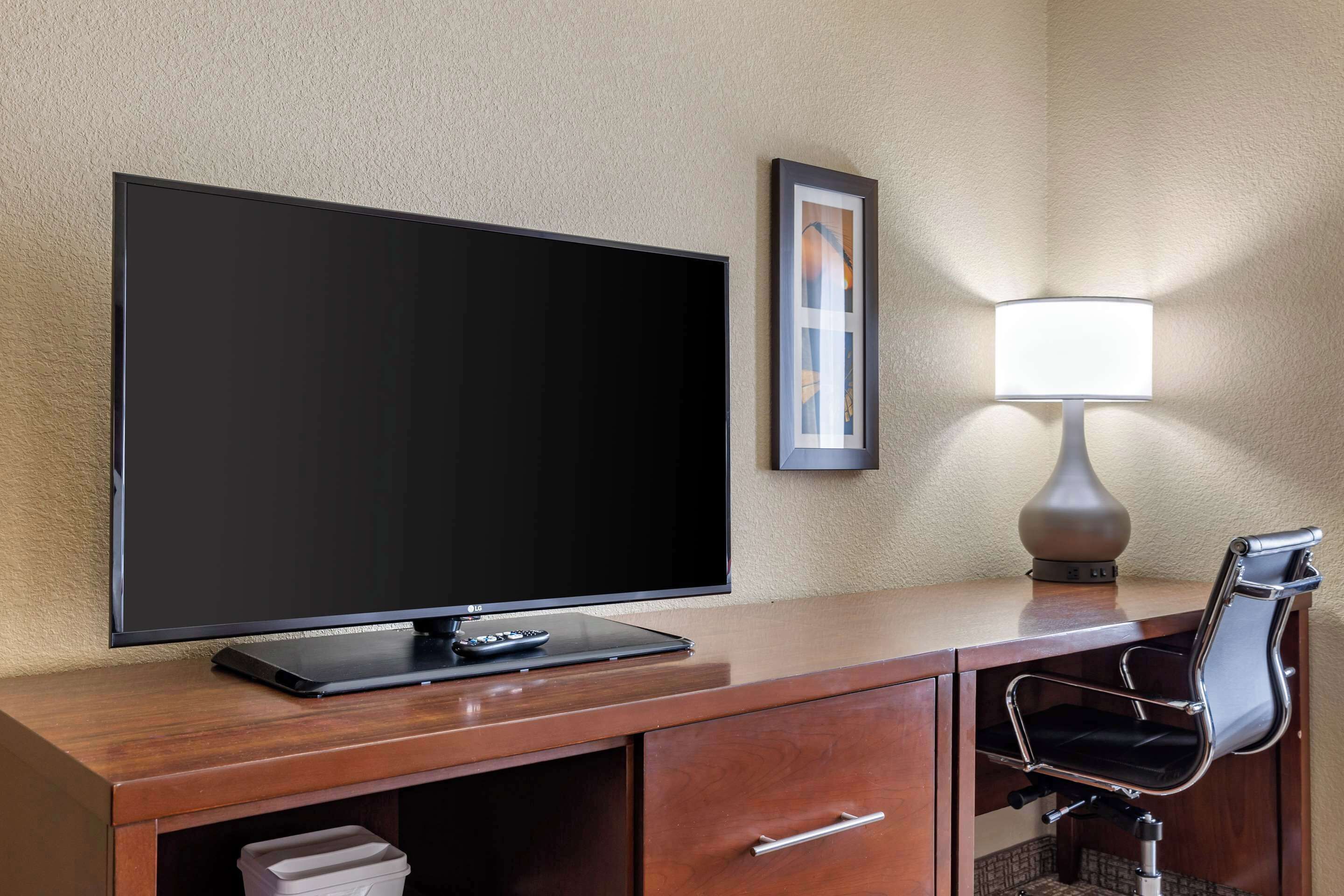 premium bedding, desk, blackout curtains, iron/ironing board