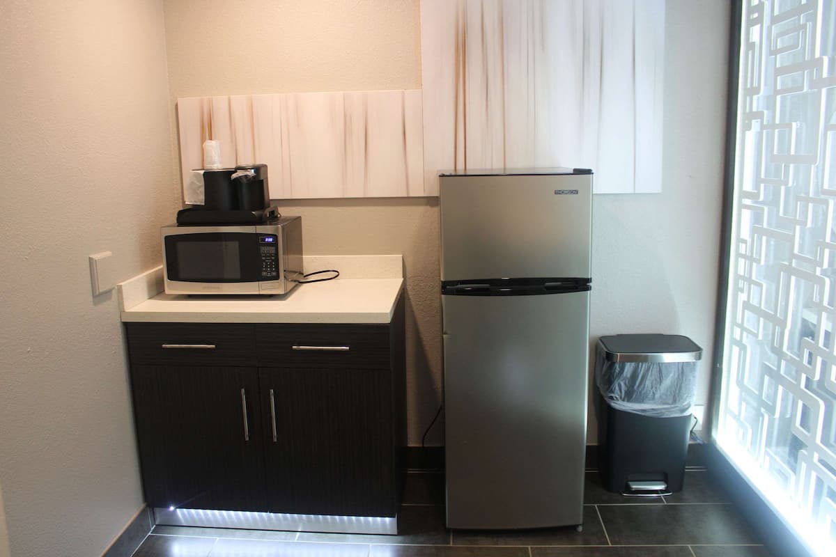 desk, laptop workspace, blackout curtains, iron/ironing board