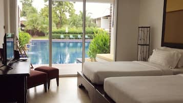 Deluxe Room, Pool Access | 1 bedroom, minibar, in-room safe, desk
