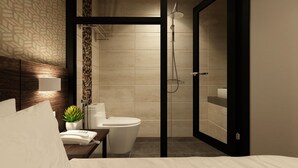 A modern hotel bathroom with a shower, toilet, and sink. - The Square Hotel (Johor Bahru)