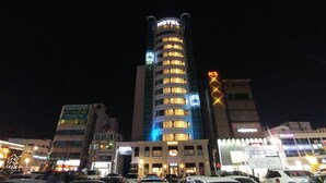 A hotel with a prominent 'HOTEL' sign, multiple floors, and a K2 sign on the side. - Gangneung Tourist Hotel (Gangneung)