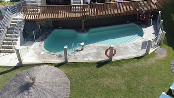 3 outdoor pools, open 11:30 AM to 9:30 PM, pool umbrellas, pool loungers