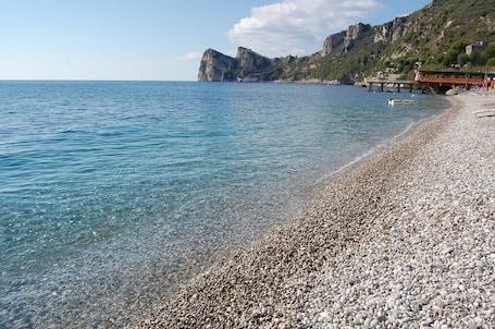 On the beach, sun-loungers, beach umbrellas, beach bar. Marina Del Cantone Chalet