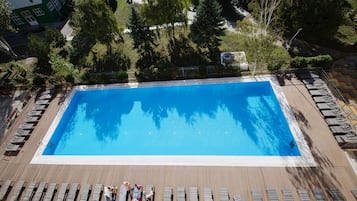 Seasonal outdoor pool, pool umbrellas, pool loungers