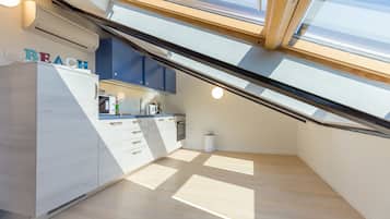 Loft Apartment | Private kitchen | Fridge, microwave, oven, stovetop