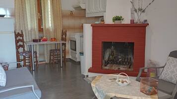 Apartment, 2 Bedrooms, Sea View | Living area | Flat-screen TV, fireplace