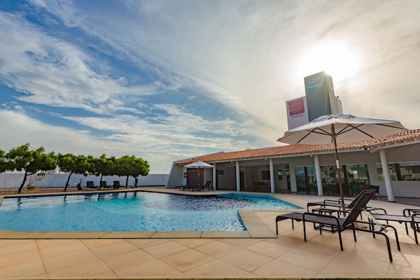 Outdoor pool, open 8:30 AM to 10:00 PM, pool loungers