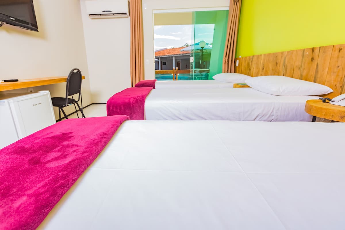 deluxe triple room, balcony, pool view | 1 bedroom, minibar, desk, laptop workspace