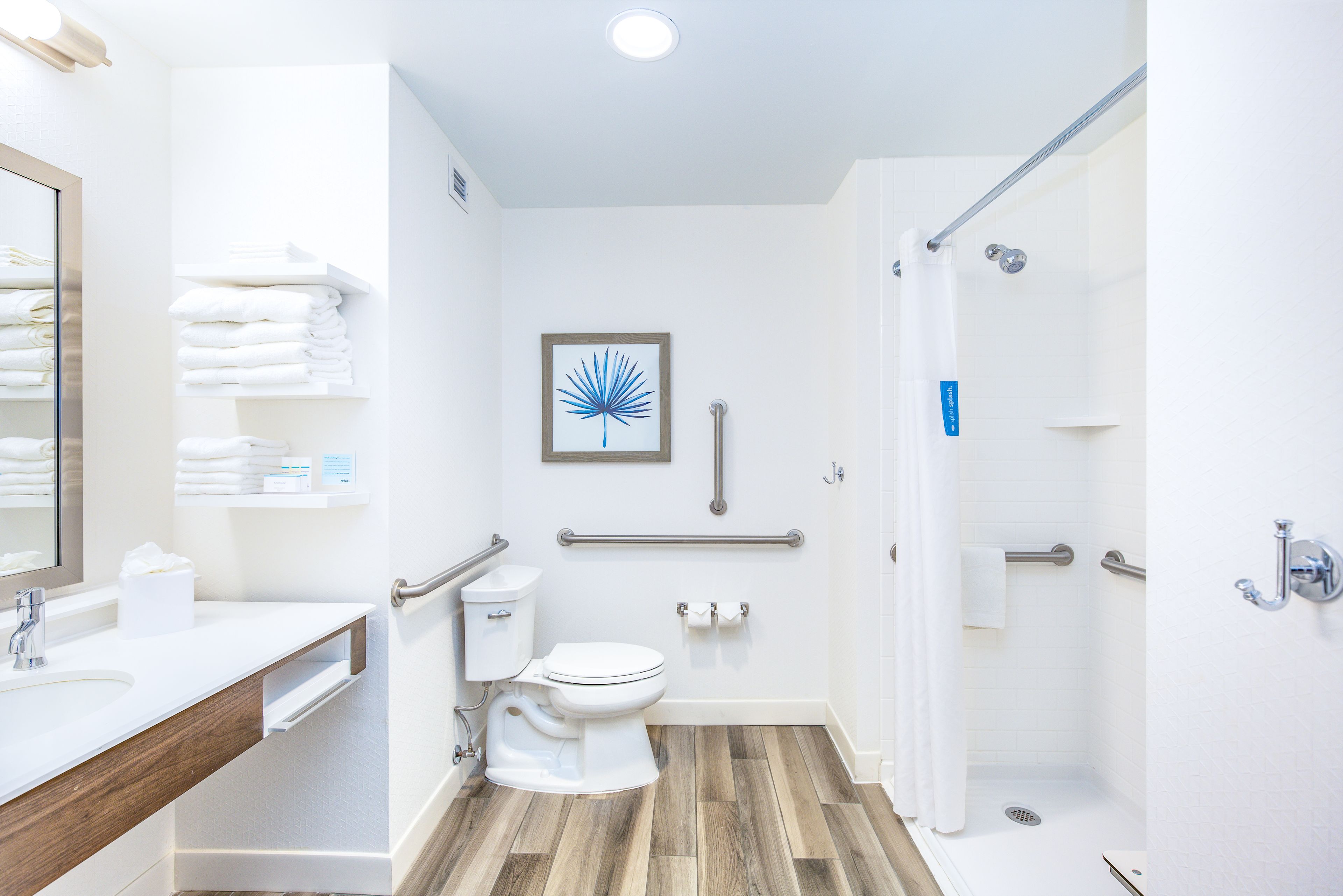 studio, 1 king bed, accessible, non smoking (mob/hearing acc w/ roll-in shower) | bathroom | combined shower/bathtub, eco-friendly toiletries, hair dryer, towels