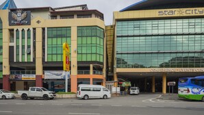 A hotel with a sign reading "Royal City" and a building labeled "Star City Conference & Events Center." - Hotel O Storytel (Kota Kinabalu)