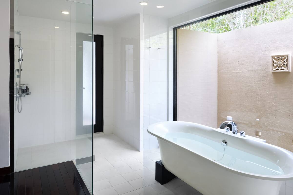 ambassador suite | bathroom | separate bathtub and shower, deep-soaking bathtub, free toiletries