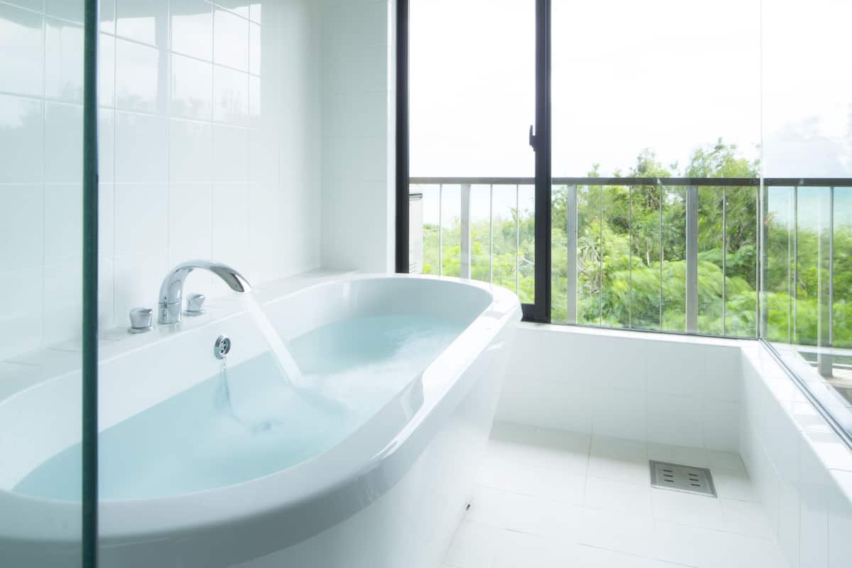 superior suite | bathroom | separate bathtub and shower, deep-soaking bathtub, free toiletries