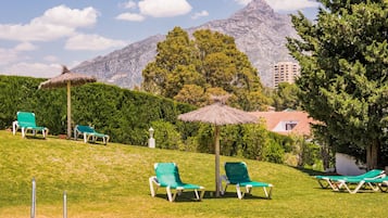 Outdoor pool, open 9 AM to 9 PM, pool umbrellas, pool loungers