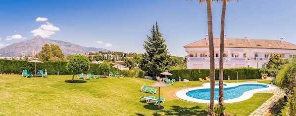 Outdoor pool, open 9 AM to 9 PM, pool umbrellas, pool loungers
