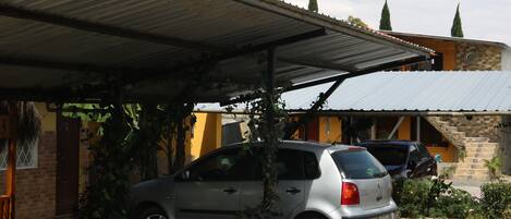 A parking area with a sign indicating 'PARKING'.