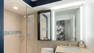 Shower, designer toiletries, hair dryer, towels