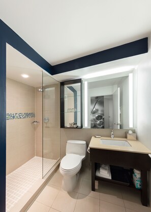 Shower, designer toiletries, hair dryer, towels