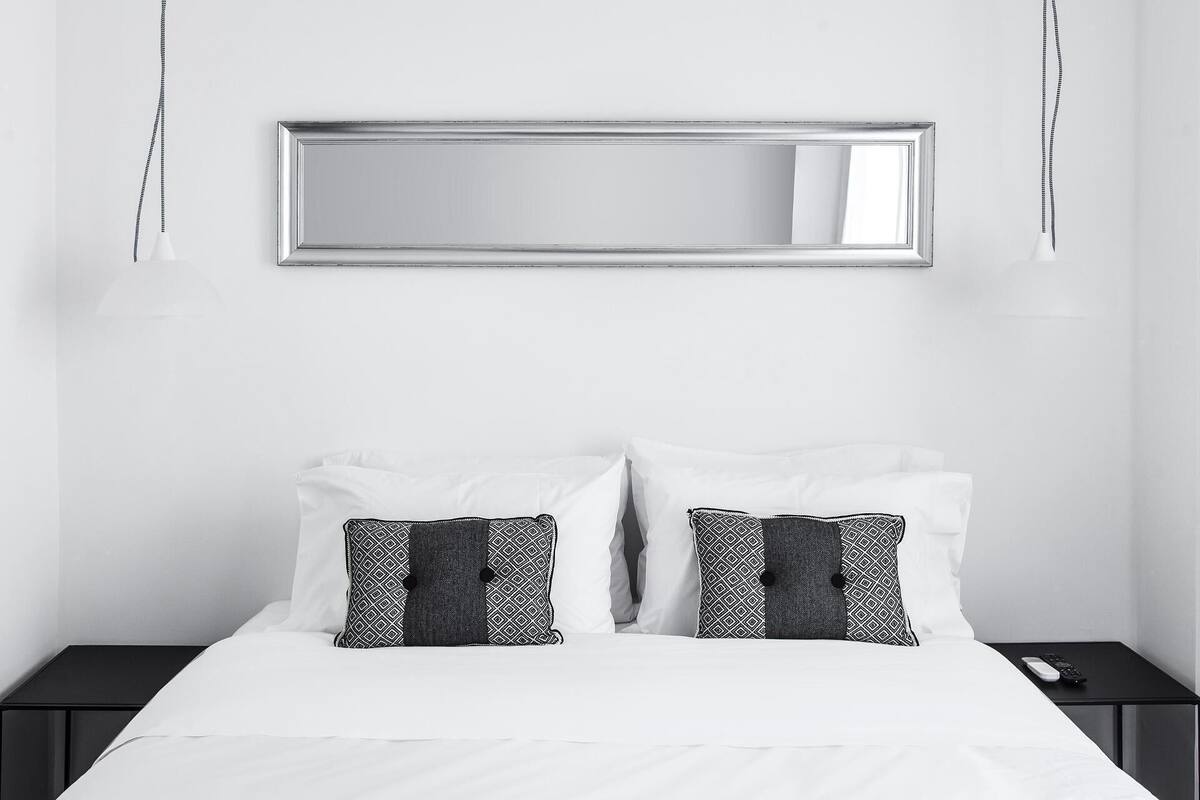 Premium bedding, down comforters, pillowtop beds, in-room safe