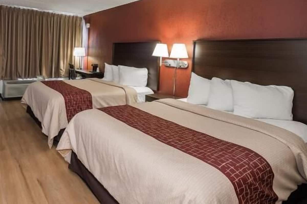 Desk, laptop workspace, iron/ironing board, free cribs/infant beds