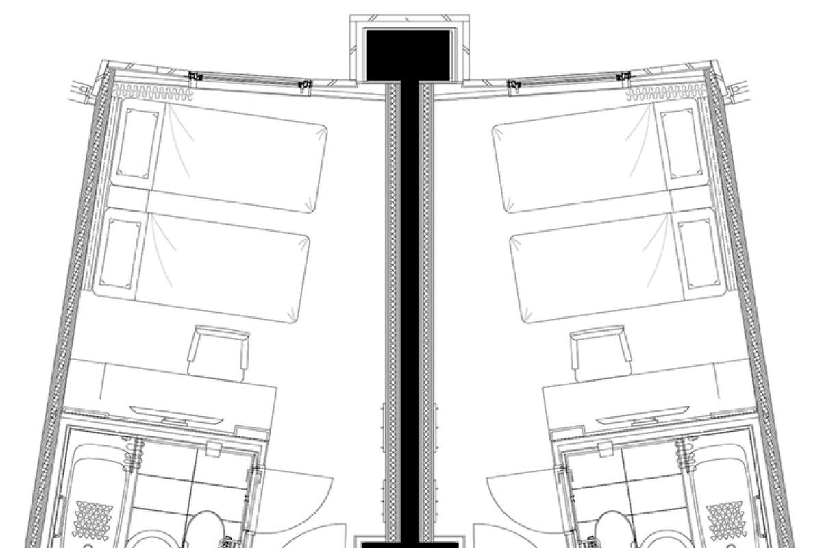 A symmetrical floor plan of a hotel room with a central corridor, two bathrooms, a kitchenette, and a bed.