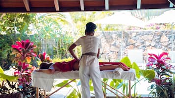 Experience a rejuvenating massage amidst lush tropical surroundings.